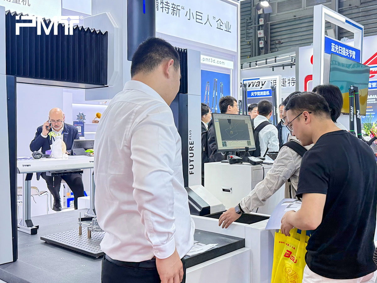 The PMT team communicates with partners about coordinate measuring machines at CCMT2026